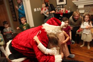 santa and charlie hug